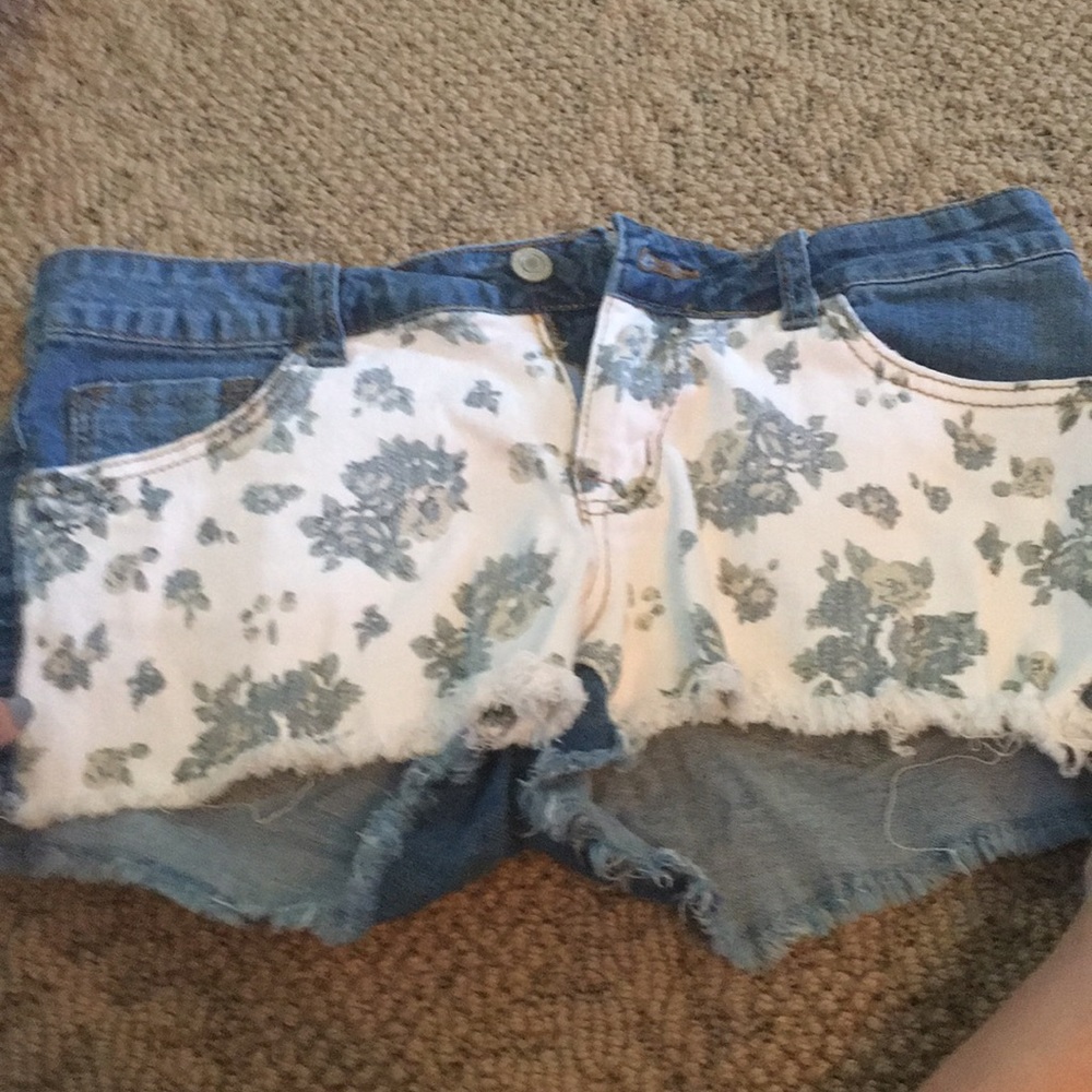 Jean shorts with a floral pattern on the front